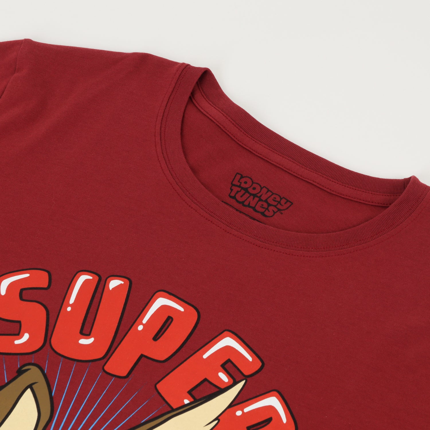 Polera Manga Corta Hombre Super Genius Burdeo Looney Tunes