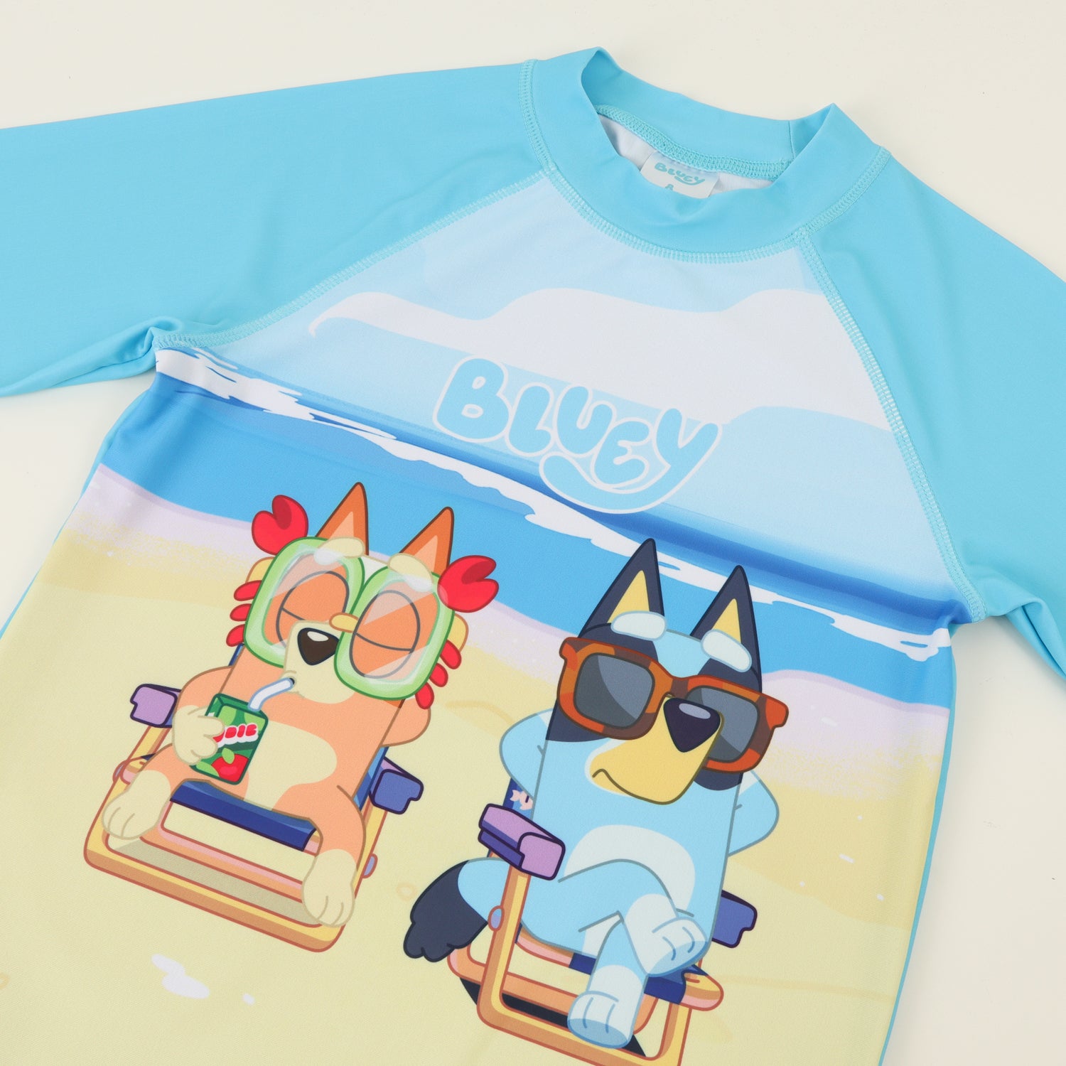 Polera UV Manga Larga Niño Celeste Playa Bingo & Bluey